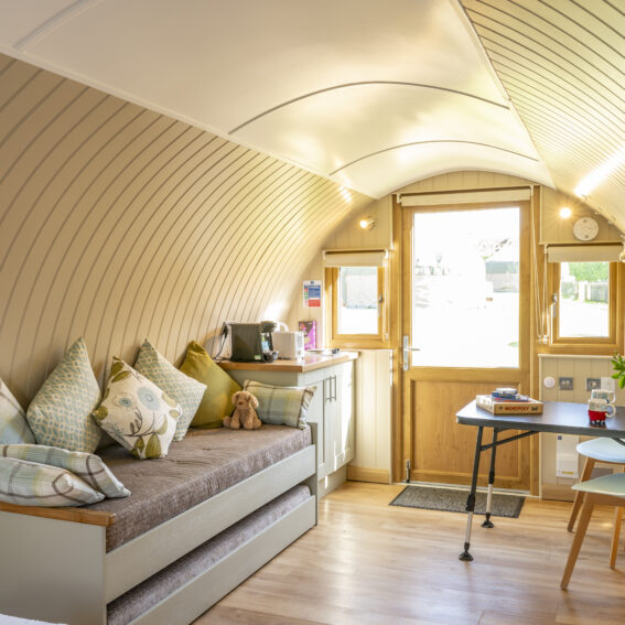 Sleeping and dining area inside the Glamping Pod