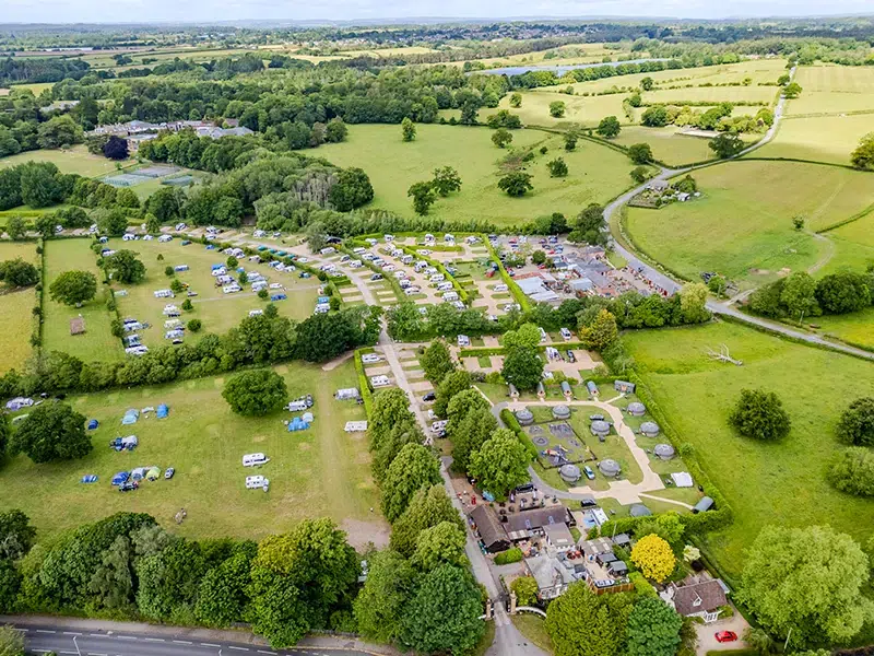 Touring caravan pitch at award-winning South Lytchett Manor site near Poole Dorset